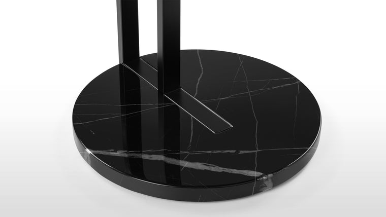 Polished to Perfection | The black marble base provides a luxurious foundation not only ensures stability but also introduces a touch of opulence. The rich texture of the marble adds depth and visual interest, making the Ralf Side Table a captivating addition to any room.
