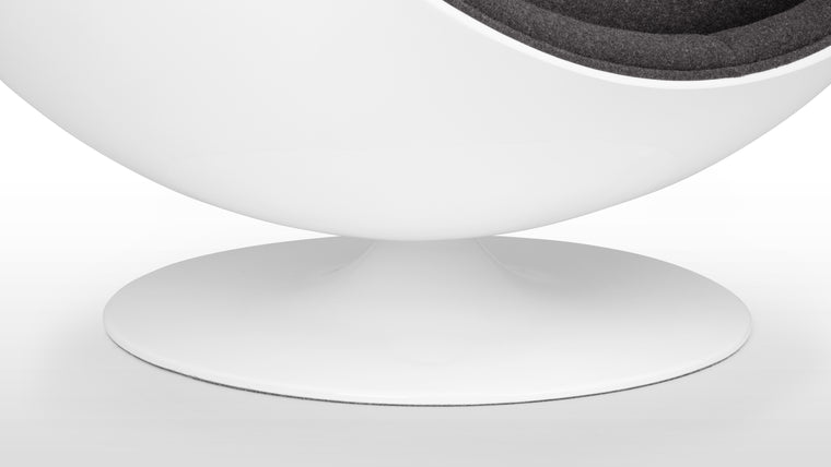 COLOR CONTRAST | Inside its white half-sphere, this unique chair features high quality upholstery for a beautiful contrast of color..
