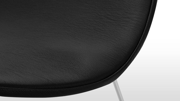 MADE TO LAST | Expertly crafted with a powdercoated steel frame and chic leather seat pad, this striking design is made by hand with longevity in mind.
