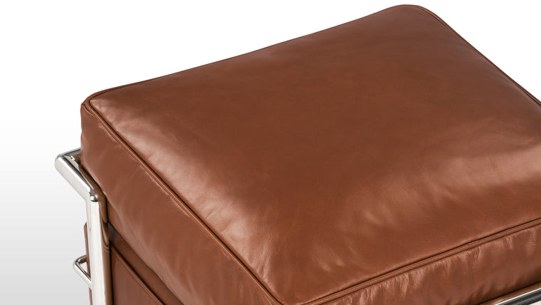 Sleek Frame | The Corbusier Ottoman boasts a sturdy and sleek stainless steel frame, which not only provides exceptional stability but also complements the leather upholstery with its polished, minimalist aesthetic. The iconic tubular frame design is instantly recognizable and adds a touch of architectural elegance to your space.

