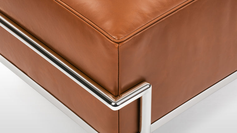 LUXURIOUS LEATHER | Crafted from premium leather, the Corbusier Ottoman exudes an air of opulence. The leather's supple texture not only feels heavenly to the touch but also ages beautifully, developing a rich patina over time that tells the story of its use.
