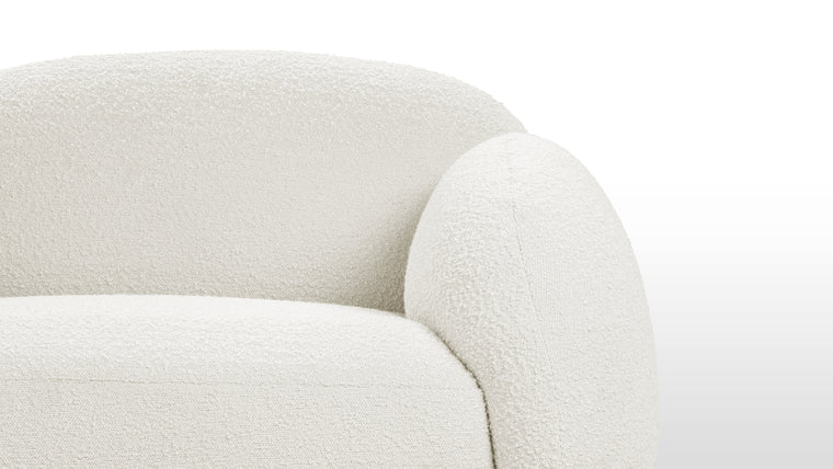 Boucle Beauty | The Gigi Sofa goes beyond mere aesthetics by incorporating high-quality materials and expert craftsmanship, ensuring longevity and enduring beauty. The premium upholstery adds a touch of opulence to this already exquisite piece. Its sturdy construction and attention to detail speak to a commitment to both form and function, making the Gigi Sofa a lasting investment in comfort and style.
