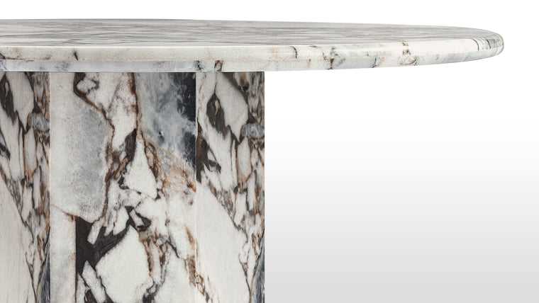 Marble Masterpiece | Made from honed natural Italian modellato marble, this beautiful modern table makes a stunning centrepiece. Its simple, striking form pays homage to this luxurious material, accentuating the distinctive texture and patina.
