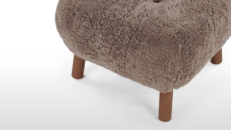 STYLISH AND VERSATILE | With a solid beech and plywood frame, the Petra is covered in HR foam and polyester wadding, and encased in Luxe Sheepskin, the Ottoman provides the ultimate cozy companion to the Lounge Chair, or as a stylish stool on its own.

