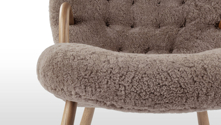 FRIENDLY FORM | Small in stature but big in terms of personality, the Clam chair is a seat that calls to you from across the room. The gentle curves of the backrest, bentwood arms, and rounded legs give this chair a friendly and inviting appearance that promises to wrap you up in hygge.
