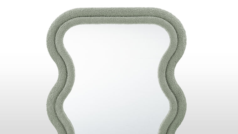 Opulent Edge | With its luxurious upholstery seamlessly enveloping the sturdy frame, the Isla Floor Mirror embodies a tactile allure that beckons to be touched. The soft, premium fabric not only adds an inviting dimension but also offers a delightful contrast to the mirror's clean, contemporary lines.
