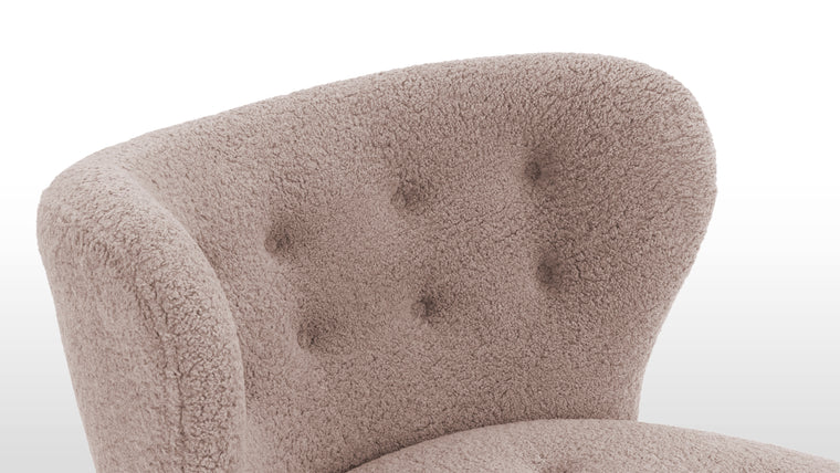CONSTRUCTED FOR COMFORT | Cocooned in luxurious vegan sheepskin, the Petra Chair offers an exceptionally cozy and comfortable lounging experience.
