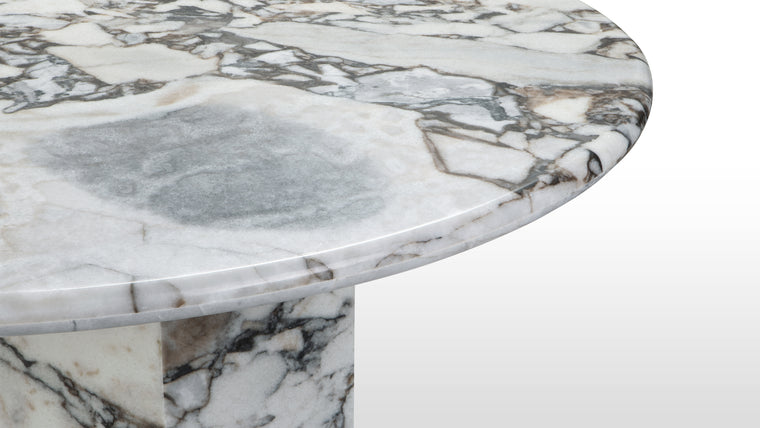 MARBLE MASTERPIECE | Made from honed natural Italian modellato marble, this beautiful modern table makes a stunning centrepiece. Its simple, striking form pays homage to this luxurious material, accentuating the distinctive texture and patina.
