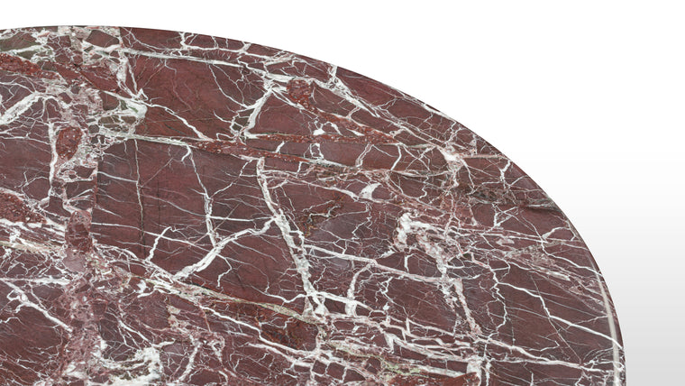 MARBLE MASTERPIECE | Made from honed natural Italian rosso levanto marble, this beautiful modern table makes a stunning centrepiece. Its simple, striking form pays homage to this luxurious material, accentuating the distinctive texture and patina.
