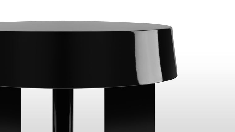 CONTEMPORARY APPEAL | The glossy finishes not only accentuate the architectural silhouette but also contribute to the table's timelessness. The reflective surfaces create an interplay of modernity and sophistication, ensuring that this side table remains a coveted centerpiece.
