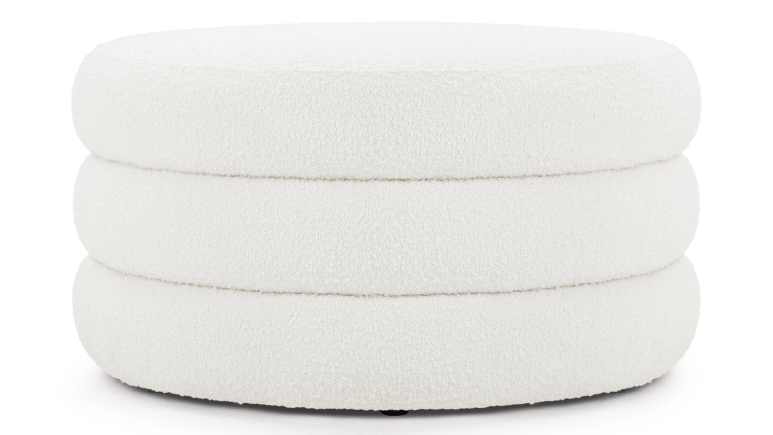 Sculptural Comfort | A statement shape in a cozy, inviting fabric, the Noa Ottoman is perfect for lounging or sitting. Its sculptural design adds a unique touch to any room.
