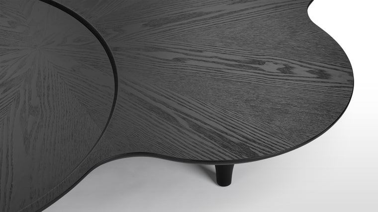 Natural Beauty | Crafted from premium birch wood, the Taki Coffee Table showcases the natural beauty of the wood grain through its elegant black finish. The material's durability and refined texture contribute to the table's high-end appearance and lasting quality.
