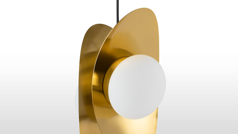 Contemporary Style | The deep, golden color and minimalistic design present a contemporary take on classic lighting shapes, the asymmetrical profile of the light inviting contemplation.
