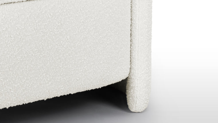 Comfortable Sitting | The bench is upholstered in high-quality boucle fabric, known for its looped texture and cushioned feel, in a subtle warm white to provide softness visually as well as while in use.
