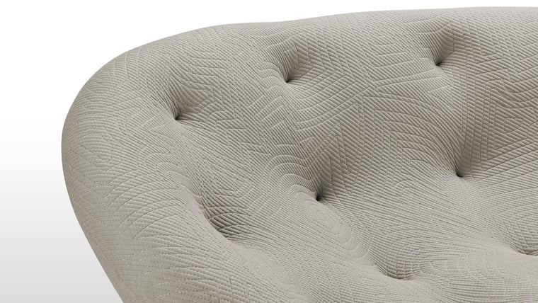 Tactile Textiles | Constructed using a combination of high-resilience foam and multi-density foam, the sofa offers a plush, enveloping feel. The upholstery, a stretchable jersey, enhances the sofa's ergonomic properties, allowing it to adapt to the body's contours seamlessly. This choice of fabric not only provides comfort but also adds to the sofa's modern, textured appearance.
