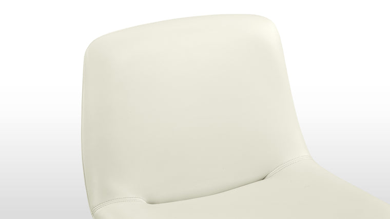 Enduring Comfort | Ergonomically curved for full body support and padded for long-lasting comfort, the design's versatile forms—side chair, armchair, or stool—make it an adaptable piece for various spaces.
