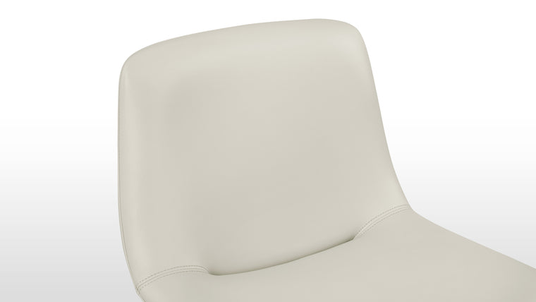 Enduring Comfort | Ergonomically curved for full body support and padded for long-lasting comfort, the design's versatile forms—side chair, armchair, or stool—make it an adaptable piece for various spaces.
