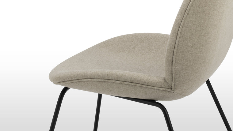 Modern Icon | The Beetle chair has garnered praise worldwide, becoming an icon of contemporary design. Available in an array of premium upholstery options.
