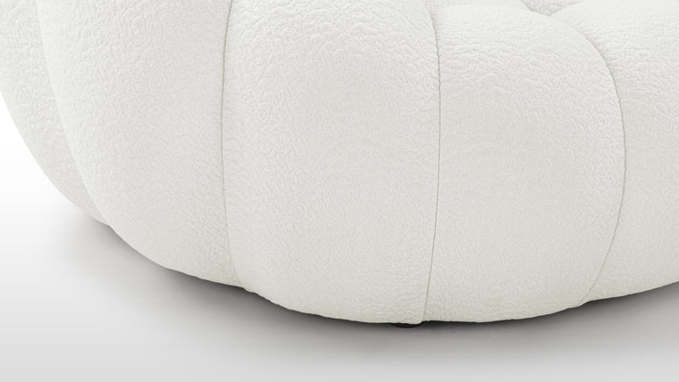CURVACEOUS COMFORT | With its innovative upholstery options, such as a knit jersey fabric boasting a unique texture, the Lounge Chair not only enhances its visual appeal but also tantalizes the senses with its luxurious tactile sensation.
