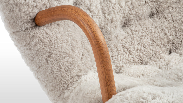 FRIENDLY FORM | Small in stature but big in terms of personality, the Clam chair is a seat that calls to you from across the room. The gentle curves of the backrest, bentwood arms, and rounded legs give this chair a friendly and inviting appearance that promises to wrap you up in hygge.
