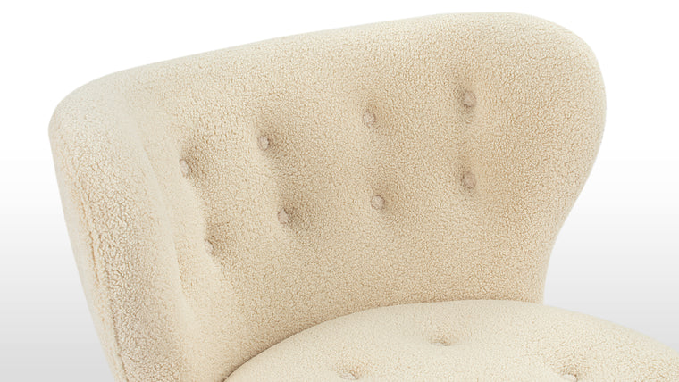 Constructed for Comfort|Cocooned in luxurious vegan sheepskin, the Petra Chair offers an exceptionally cozy and comfortable lounging experience.
