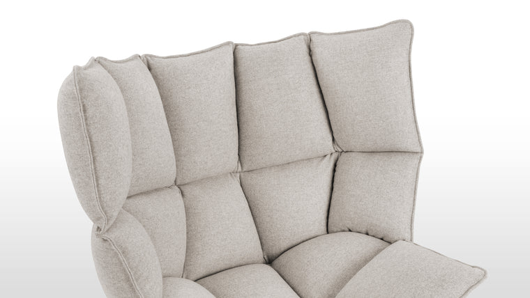 Textile Symphony | Wrapped in luxurious wool, this chair features high-density foam padding nestled within a fibreglass shell. The combination of premium materials ensures both comfort and structural durability.
