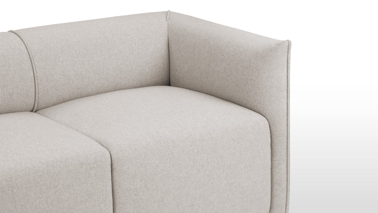 Premium Comfort | Crafted with deeply padded cushioning, the loveseat features a soft wool upholstery that wraps around its padded arms and backrest, providing both style and superior comfort. Small, unobtrusive legs add a seamless, modern touch.
