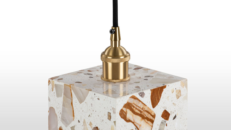 Italian Inspired Materials | Made from terrazzo panels, iron fittings with a brass finish, and a sleek black cord, this light showcases durable and stylish materials that enhance its contemporary appeal.
