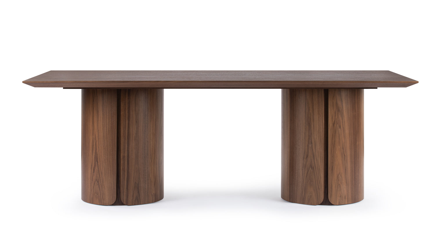 Dine With Impact | The Opus Dining Table embodies a modern yet timeless aesthetic, blending rich walnut tones with a unique sculptural base, making it a visually striking centerpiece that enhances any dining space.
