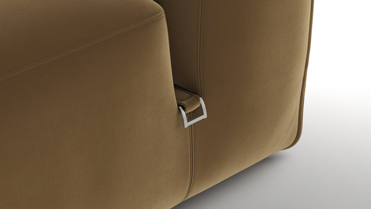 Premium Texture | Available in both neutral-toned fabric and leather or vegan suede, the collection features a foam interior for deep comfort, with understated wooden legs and sleek metal buckles for easy configuration.
