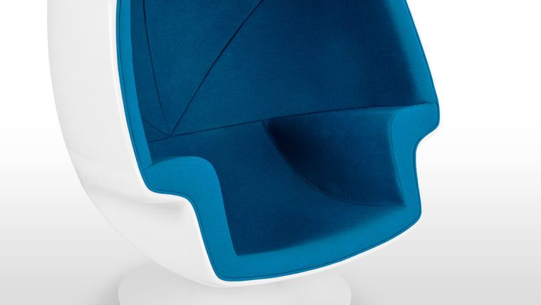 Additional Comfort | Designed for relaxation, the chair provides a cozy, enclosed seating experience with its inward-curving sides for additional comfort. Its weighted base allows for easy swiveling, adding functionality to its iconic style.
