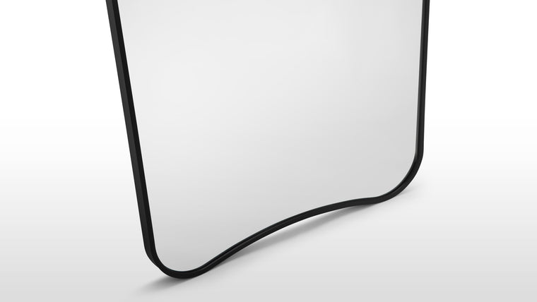 Slim Frame | A narrow metal border defines the form without overwhelming it—offering just enough structure to feel finished, while keeping the focus on light and reflection.
