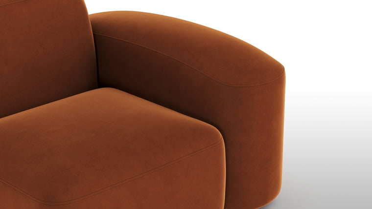 Warm Minimalism | Minimalist yet striking, the modules feature soft velvet upholstery, chunky arms, rounded edges, and detailed stitchwork for tactile and visual intrigue. The burnt orange hue adds a touch of warmth and timeless sophistication.
