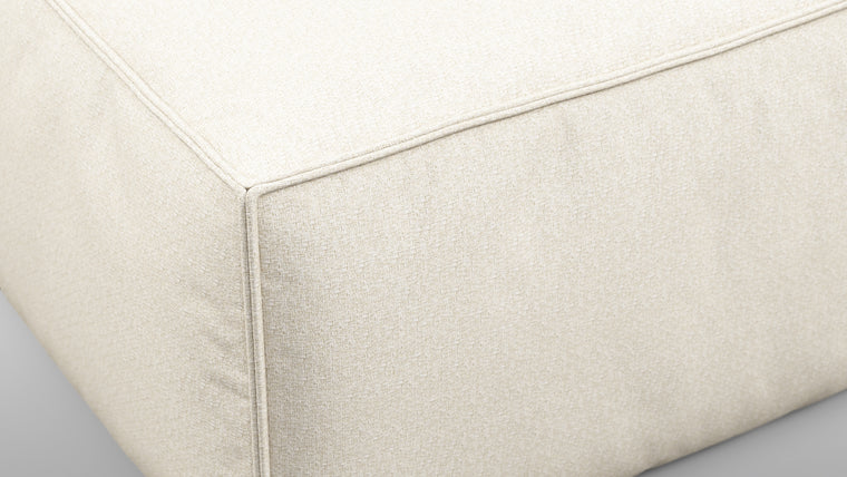 Durable Modernity | Featuring a boxy silhouette with deep seating, the collection is wrapped in neutral beige outdoor fabric and supported by a sleek, aluminum frame—blending modern design with durable materials.
