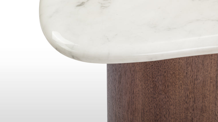 Striking Materials | The table combines contemporary design with premium materials, including a curved Italian marble top and a strong, minimalist base for a cohesive look.
