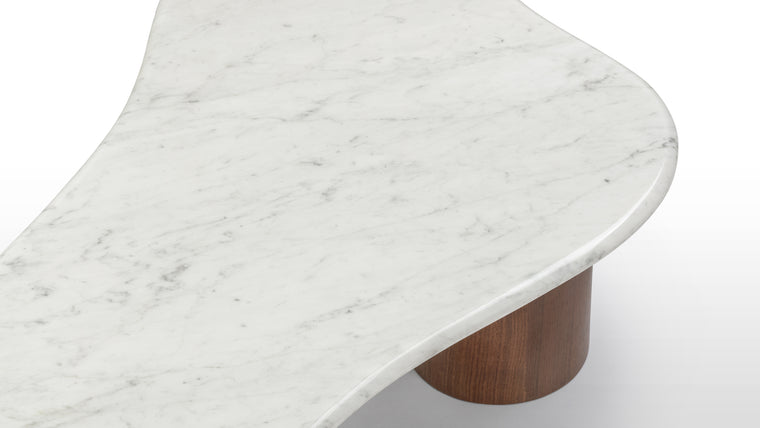 Striking Materials | Crafted with premium Italian marble featuring natural veining, the table’s organic form and rounded edges radiate modern elegance.
