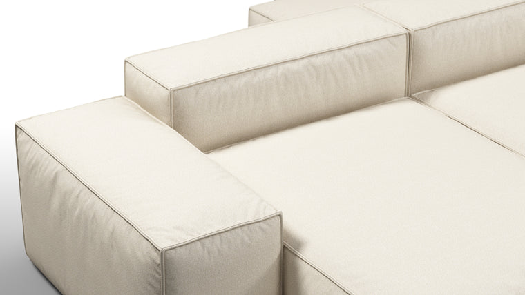 Durable Modernity | Featuring a boxy silhouette with deep seating, the collection is wrapped in neutral beige outdoor fabric and supported by a sleek, aluminum frame—blending modern design with durable materials.
