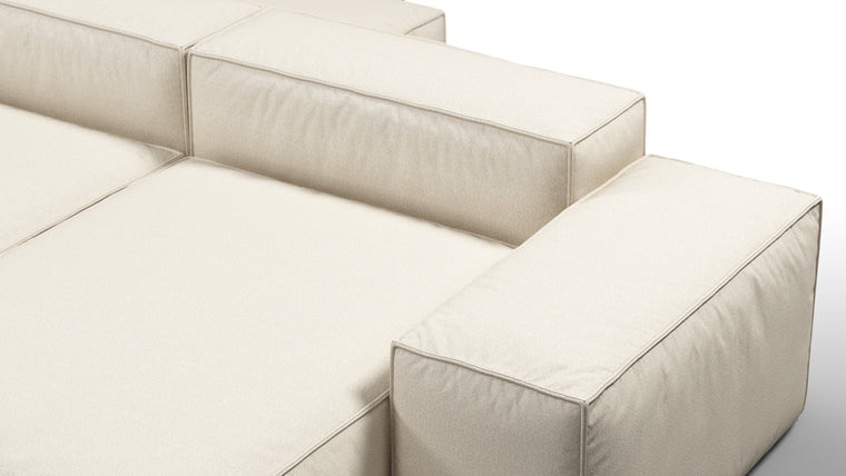 Durable Modernity | Featuring a boxy silhouette with deep seating, the collection is wrapped in neutral beige outdoor fabric and supported by a sleek, aluminum frame—blending modern design with durable materials.
