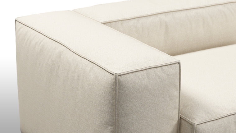 Durable Modernity | Featuring a boxy silhouette with deep seating, the collection is wrapped in neutral beige outdoor fabric and supported by a sleek, aluminum frame—blending modern design with durable materials.
