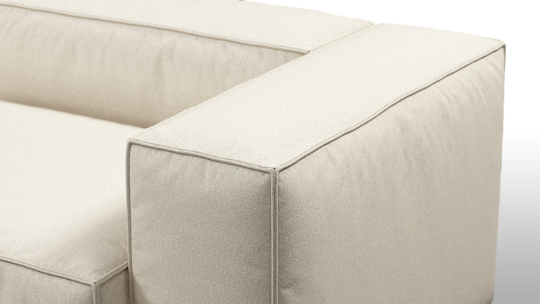 Durable Modernity | Featuring a boxy silhouette with deep seating, the collection is wrapped in neutral beige outdoor fabric and supported by a sleek, aluminum frame—blending modern design with durable materials.
