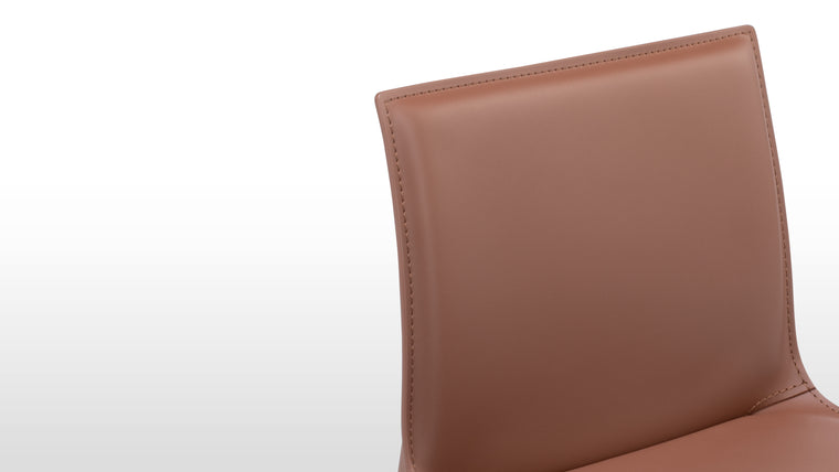 Premium Leather Upholstery | Enjoy the supple feel and enduring quality of top-grade leather that covers every inch of the stool, from seat to legs.

