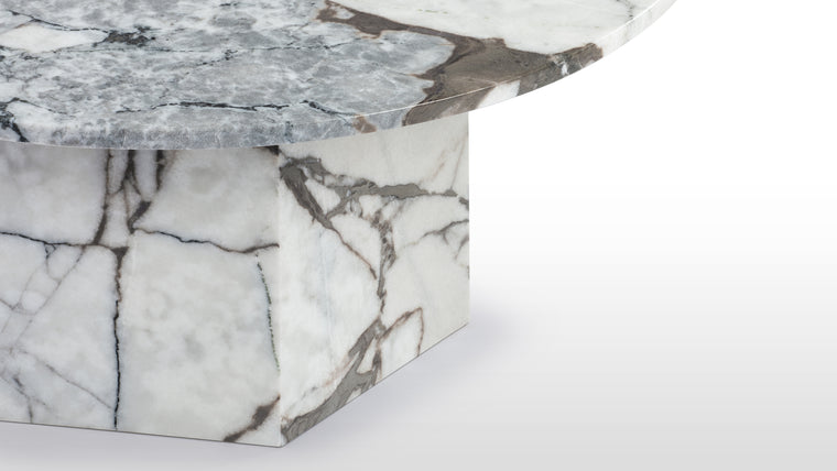 Stone Masterpiece | Made from honed natural Italian marble or travertine, this beautiful modern table makes a stunning centrepiece. Its simple, striking form pays homage to this luxurious material, accentuating the distinctive texture and patina.
