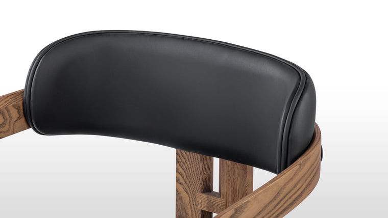 Material Harmony | Crafted with high-quality wood and refined upholstery, the Pamplona Chair showcases the warmth of natural materials. The contrast between its sleek lines and soft seat creates a balanced aesthetic that complements a wide range of interior styles.
