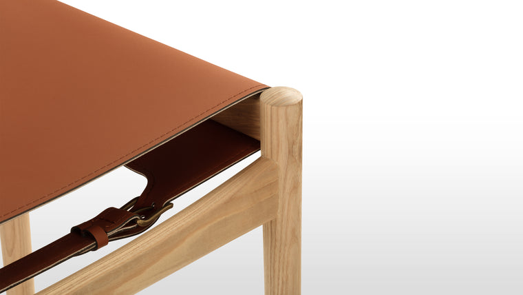 Sophisticated Sling | With its gently curved backrest and contoured sling seat, the Aksel Counter Stool offers exceptional comfort during mealtimes. The carefully chosen vegan leather upholstery adds a touch of luxury and elegance while allowing comfortable sitting and entertaining for hours.
