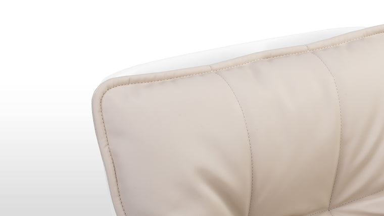 Textile Symphony | Wrapped in luxurious vegan leather, this chair features high-density foam padding nestled within a fibreglass shell. The combination of premium materials ensures both comfort and structural durability.
