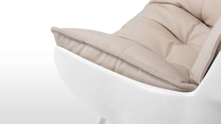 Cocooned Comfort | Thoughtfully designed to cradle the body, this lounge chair offers ergonomic support through its padded, molded structure. It seamlessly balances style and relaxation, perfect for unwinding.
