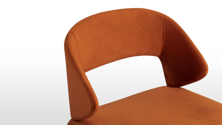 Luxe Upholstery | Crafted with soft velvet upholstery and foam padding, the Suit Chair combines rich texture with bold, flowing lines. Its contemporary shape and luxe materials give it a refined yet artistic presence.
