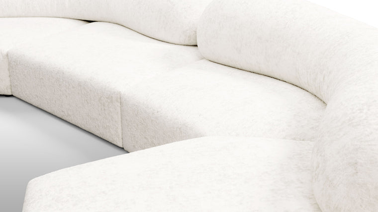 Redefining Relaxation | The cushioning of the sofa provides a unique seating experience that combines softness with support, ensuring that the sofa remains comfortable for extended periods. The sofa’s low profile and generous dimensions encourage a laid-back lounging posture, making it perfect for both casual and formal settings.
