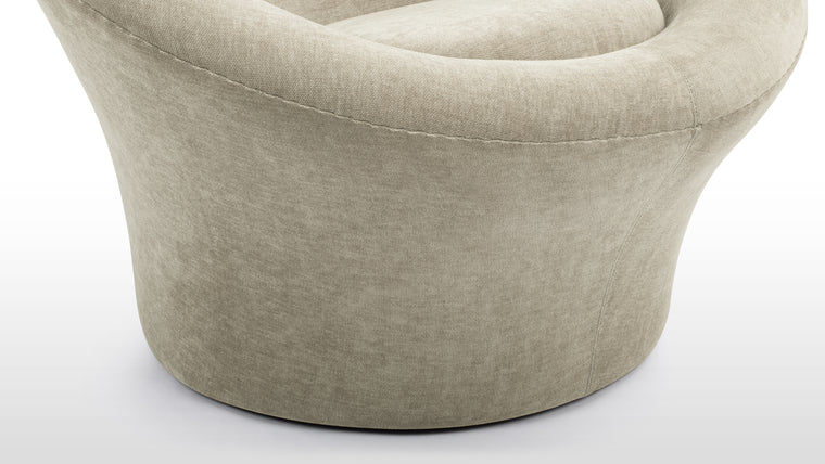 Material, Made Meaningful | Upholstered in premium fabric that conforms to the chair’s contours, the surface feels as effortless as it looks. The upholstery is not just decorative—it works in concert with the design, emphasizing its unity and amplifying its soft sculptural appeal.
