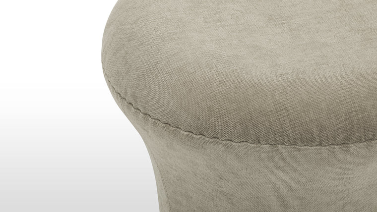 Purposeful Comfort | Thoughtfully sized to elevate your lounging experience, this compact ottoman offers gentle support whether used as a footrest or an occasional seat.
